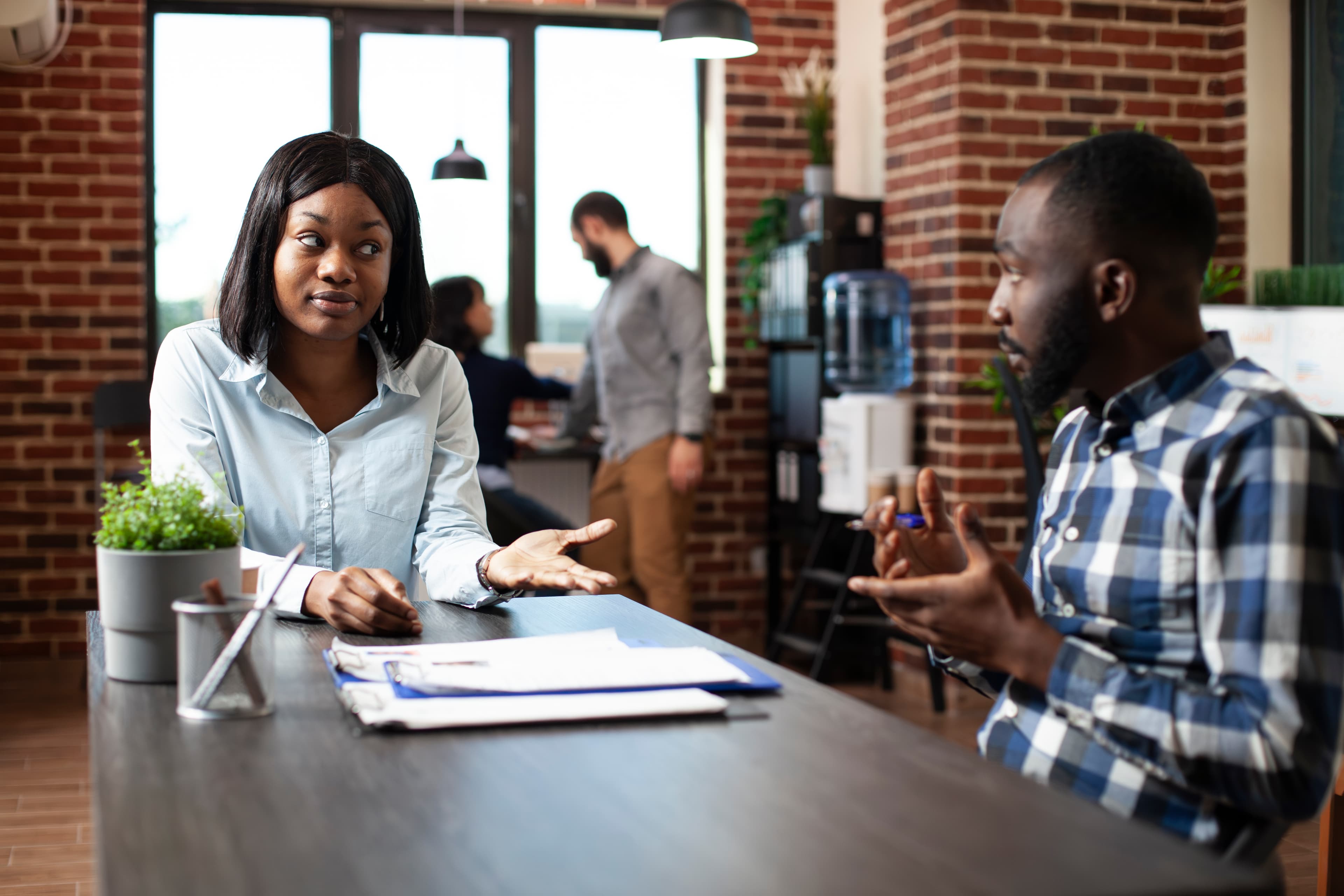 Two people shaking hands during a professional meeting at the start of a placement conversation.